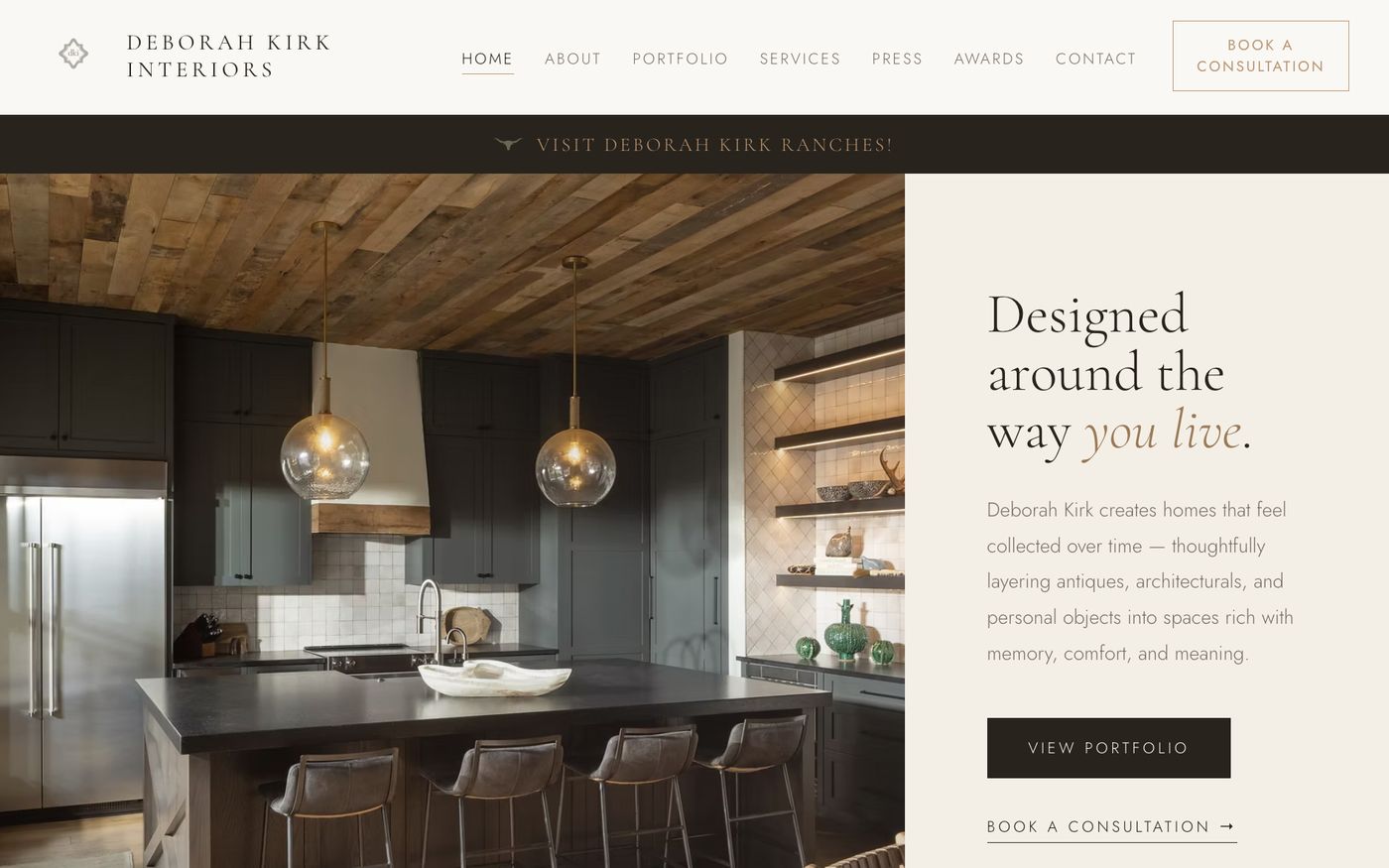 The new Deborah Kirk Interiors homepage: a full-width kitchen photo, an elegant serif headline, a clear Book a Consultation button, and a row of credentials